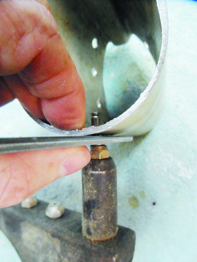 tapping sailboat spar